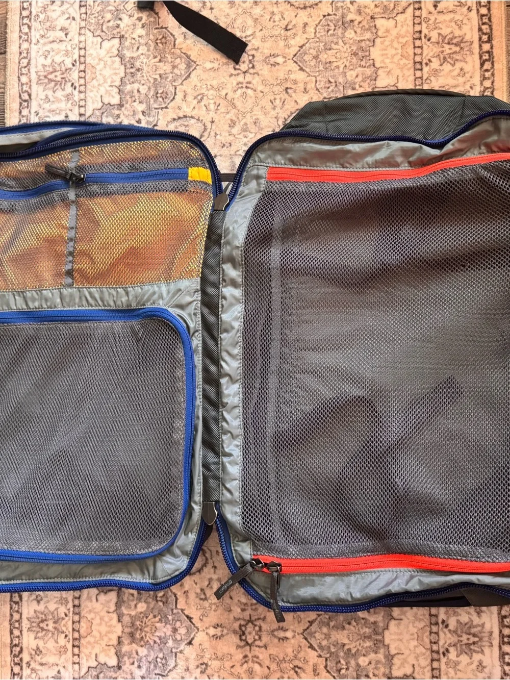 cotopaxi Light Blue Backpack with Red, Orange, Teal & Purple Accents